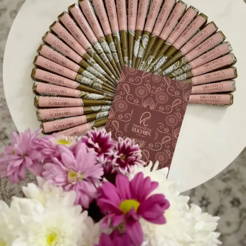 Natural henna cones arranged in a display with MehndiByRuqayya branding